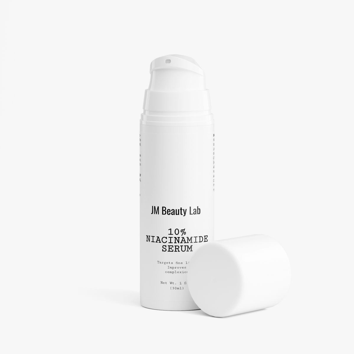 Niacinamide serum bottle by JM Beauty Lab, white with cap and second container
