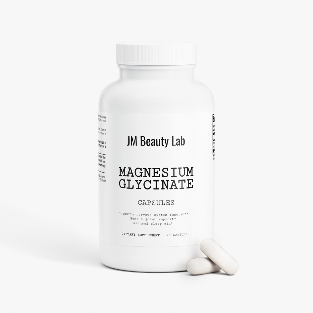 Magnesium glycinate supplement bottle with single white capsule on floor