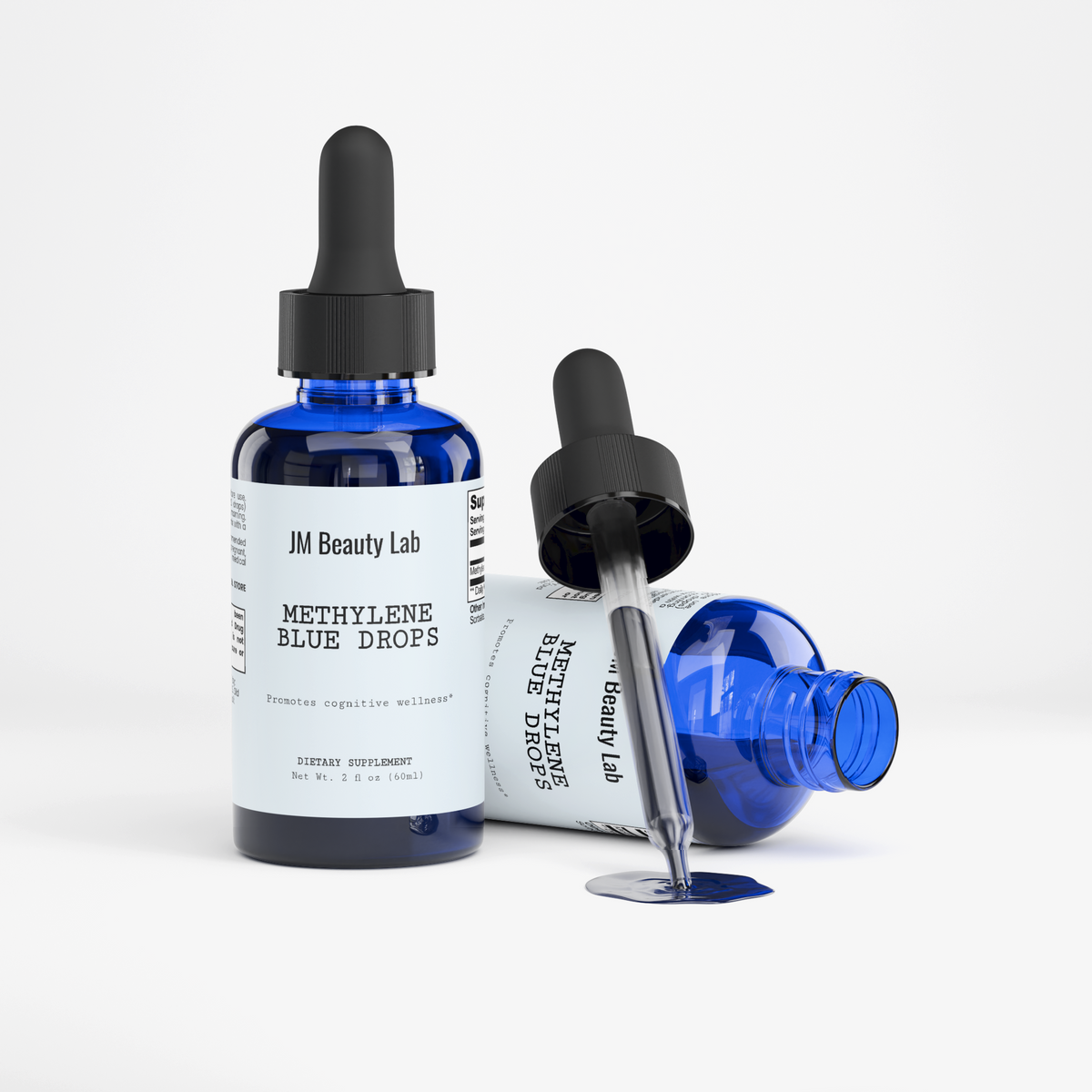Blue drops serum bottles with black droppers and a pool of blue liquid