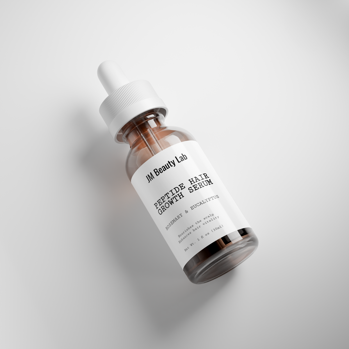 Hair growth serum bottle with white dropper and label, amber serum