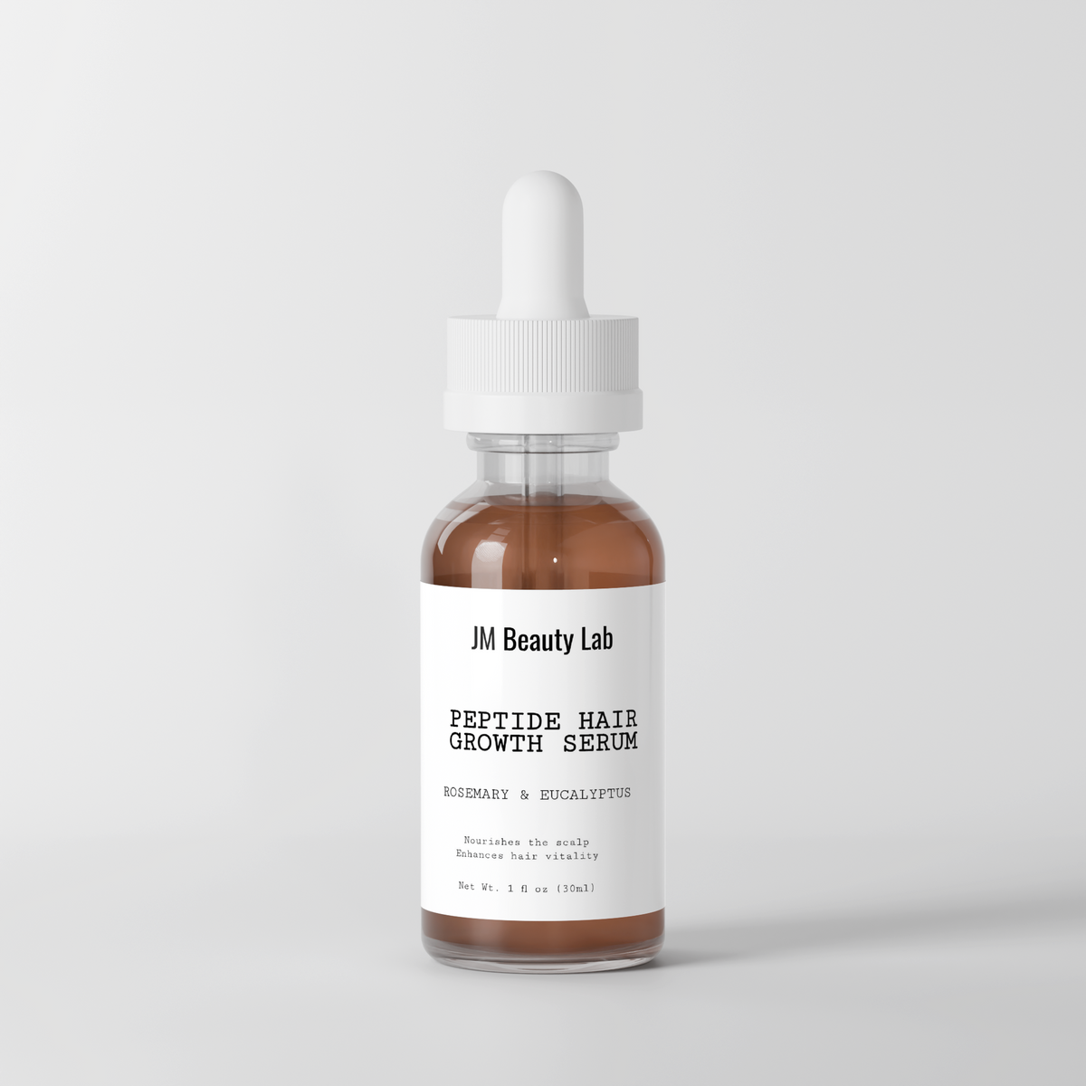 Hair growth serum bottle with label, white dropper, amber liquid